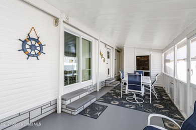 Immaculate and exquisitely updated 2-bedroom, 2-bathroom retreat on Barefoot Bay Golf Course in Florida - for sale on GolfHomes.com, golf home, golf lot