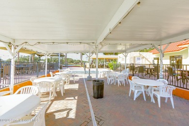 Immaculate and exquisitely updated 2-bedroom, 2-bathroom retreat on Barefoot Bay Golf Course in Florida - for sale on GolfHomes.com, golf home, golf lot