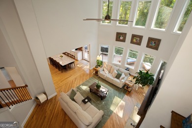 Price to move, this custom-built home sits on a roundabout on Hampton Golf Village in Georgia - for sale on GolfHomes.com, golf home, golf lot