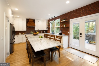 Price to move, this custom-built home sits on a roundabout on Hampton Golf Village in Georgia - for sale on GolfHomes.com, golf home, golf lot