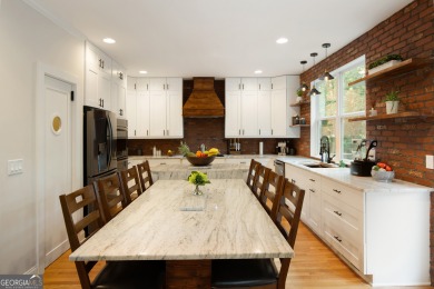 Price to move, this custom-built home sits on a roundabout on Hampton Golf Village in Georgia - for sale on GolfHomes.com, golf home, golf lot