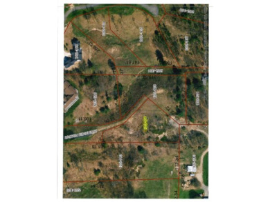 Broken Ridge building site offering beautiful lake views of on Wequetonsing Golf Course in Michigan - for sale on GolfHomes.com, golf home, golf lot