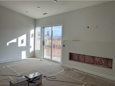 Sweeping open layout with vaulted great room and cozy fireplace on Sky Mountain Golf Course in Utah - for sale on GolfHomes.com, golf home, golf lot