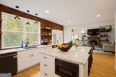 Price to move, this custom-built home sits on a roundabout on Hampton Golf Village in Georgia - for sale on GolfHomes.com, golf home, golf lot