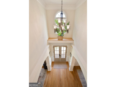 Price to move, this custom-built home sits on a roundabout on Hampton Golf Village in Georgia - for sale on GolfHomes.com, golf home, golf lot