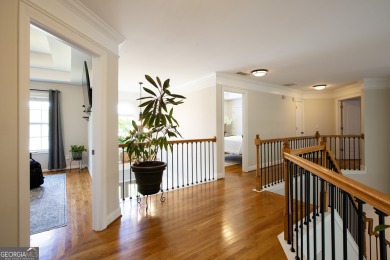 Price to move, this custom-built home sits on a roundabout on Hampton Golf Village in Georgia - for sale on GolfHomes.com, golf home, golf lot
