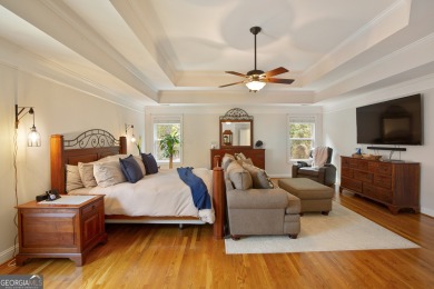 Price to move, this custom-built home sits on a roundabout on Hampton Golf Village in Georgia - for sale on GolfHomes.com, golf home, golf lot