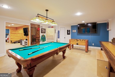 Price to move, this custom-built home sits on a roundabout on Hampton Golf Village in Georgia - for sale on GolfHomes.com, golf home, golf lot