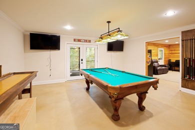 Price to move, this custom-built home sits on a roundabout on Hampton Golf Village in Georgia - for sale on GolfHomes.com, golf home, golf lot