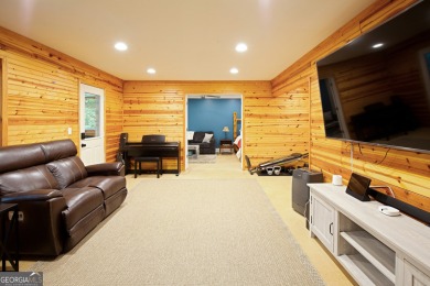 Price to move, this custom-built home sits on a roundabout on Hampton Golf Village in Georgia - for sale on GolfHomes.com, golf home, golf lot