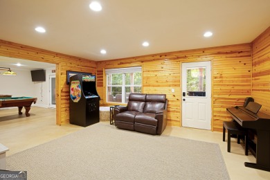 Price to move, this custom-built home sits on a roundabout on Hampton Golf Village in Georgia - for sale on GolfHomes.com, golf home, golf lot