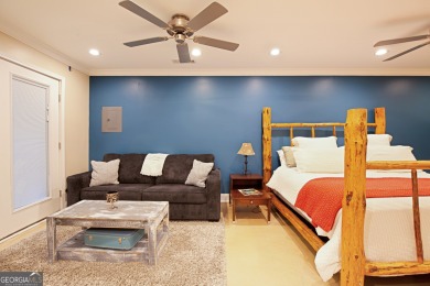 Price to move, this custom-built home sits on a roundabout on Hampton Golf Village in Georgia - for sale on GolfHomes.com, golf home, golf lot