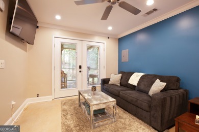 Price to move, this custom-built home sits on a roundabout on Hampton Golf Village in Georgia - for sale on GolfHomes.com, golf home, golf lot