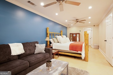 Price to move, this custom-built home sits on a roundabout on Hampton Golf Village in Georgia - for sale on GolfHomes.com, golf home, golf lot