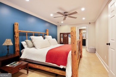 Price to move, this custom-built home sits on a roundabout on Hampton Golf Village in Georgia - for sale on GolfHomes.com, golf home, golf lot