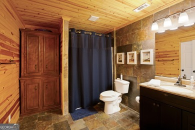 Price to move, this custom-built home sits on a roundabout on Hampton Golf Village in Georgia - for sale on GolfHomes.com, golf home, golf lot