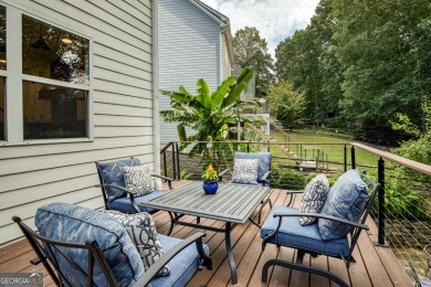 Price to move, this custom-built home sits on a roundabout on Hampton Golf Village in Georgia - for sale on GolfHomes.com, golf home, golf lot