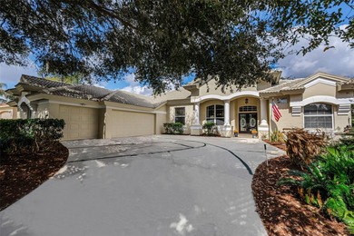 Experience timeless elegance and refined living in this stunning on Lake Jovita Golf and Country Club in Florida - for sale on GolfHomes.com, golf home, golf lot
