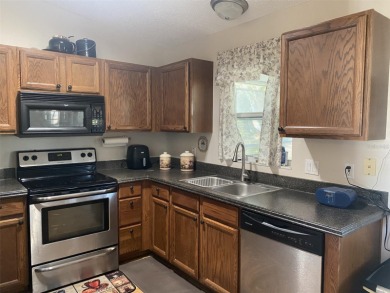 Outstanding one-story home with a screened porch and a beautiful on Plantation Golf Club in Florida - for sale on GolfHomes.com, golf home, golf lot