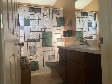 Outstanding one-story home with a screened porch and a beautiful on Plantation Golf Club in Florida - for sale on GolfHomes.com, golf home, golf lot