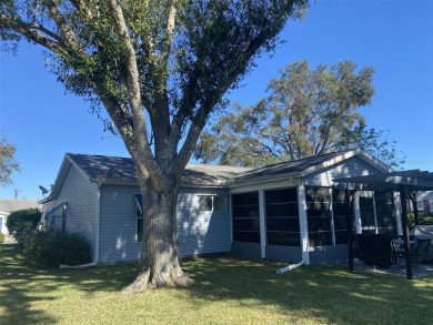 Outstanding one-story home with a screened porch and a beautiful on Plantation Golf Club in Florida - for sale on GolfHomes.com, golf home, golf lot