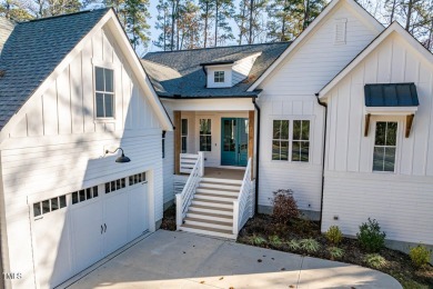 This modern farmhouse is a dream for anyone who loves both style on The Preserve At Jordan Lake Golf Club in North Carolina - for sale on GolfHomes.com, golf home, golf lot