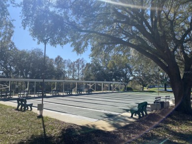 Outstanding one-story home with a screened porch and a beautiful on Plantation Golf Club in Florida - for sale on GolfHomes.com, golf home, golf lot