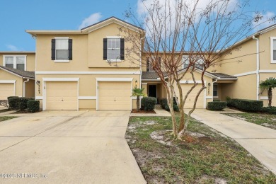 Enjoy low-maintenance living in this two-story townhome located on Golf Club At Fleming Island in Florida - for sale on GolfHomes.com, golf home, golf lot