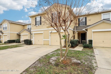 Enjoy low-maintenance living in this two-story townhome located on Golf Club At Fleming Island in Florida - for sale on GolfHomes.com, golf home, golf lot