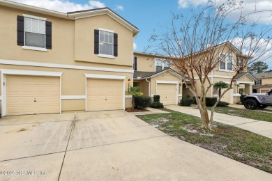 Enjoy low-maintenance living in this two-story townhome located on Golf Club At Fleming Island in Florida - for sale on GolfHomes.com, golf home, golf lot