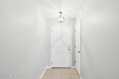 Enjoy low-maintenance living in this two-story townhome located on Golf Club At Fleming Island in Florida - for sale on GolfHomes.com, golf home, golf lot