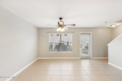 Enjoy low-maintenance living in this two-story townhome located on Golf Club At Fleming Island in Florida - for sale on GolfHomes.com, golf home, golf lot