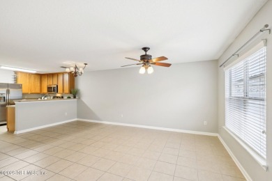 Enjoy low-maintenance living in this two-story townhome located on Golf Club At Fleming Island in Florida - for sale on GolfHomes.com, golf home, golf lot