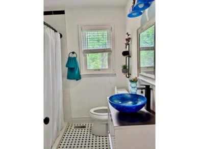 Charming home nestled in Hidden Valley. Only a few steps away on Hidden Valley Golf and Country Club in Tennessee - for sale on GolfHomes.com, golf home, golf lot