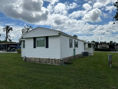 Lot 234 is a beautifully landscaped corner lot located in on Anglers Green Golf Course in Florida - for sale on GolfHomes.com, golf home, golf lot