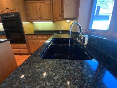 Welcome to this stunning, move-in-ready home located on the 14th on River Oaks Golf Club in Minnesota - for sale on GolfHomes.com, golf home, golf lot