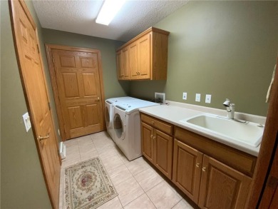 Welcome to this stunning, move-in-ready home located on the 14th on River Oaks Golf Club in Minnesota - for sale on GolfHomes.com, golf home, golf lot