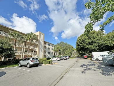 **DRASTIC REDUCTION** GATED, GOLF COMMUNITY WITH THEATER on Wynmoor Golf Course in Florida - for sale on GolfHomes.com, golf home, golf lot