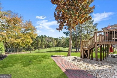 Enjoy Unbeatable views from Morning Coffee to Golden Hour - on Hamilton Mill Golf Club in Georgia - for sale on GolfHomes.com, golf home, golf lot