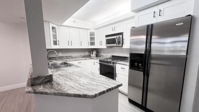 Imagine enjoying your day in a peaceful community with your own on Feather Sound Country Club in Florida - for sale on GolfHomes.com, golf home, golf lot