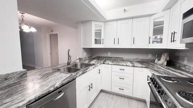 Imagine enjoying your day in a peaceful community with your own on Feather Sound Country Club in Florida - for sale on GolfHomes.com, golf home, golf lot