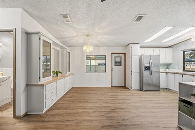 Stunning, completely remodeled 2-bedroom, 2-bathroom home with on Zellwood Station Country Club in Florida - for sale on GolfHomes.com, golf home, golf lot