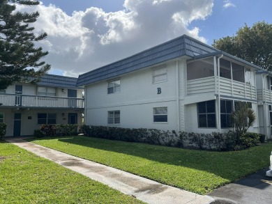 Light and bright second floor end-unit in Tuscany at Kings Point on Kings Point Golf - Executive in Florida - for sale on GolfHomes.com, golf home, golf lot