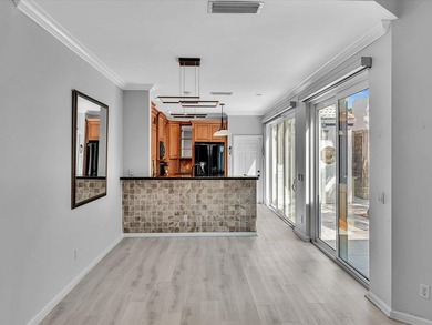 Experience the best of Florida living in this elegant courtyard on The Boca Country Club in Florida - for sale on GolfHomes.com, golf home, golf lot