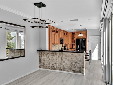 Experience the best of Florida living in this elegant courtyard on The Boca Country Club in Florida - for sale on GolfHomes.com, golf home, golf lot