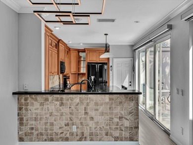 Experience the best of Florida living in this elegant courtyard on The Boca Country Club in Florida - for sale on GolfHomes.com, golf home, golf lot