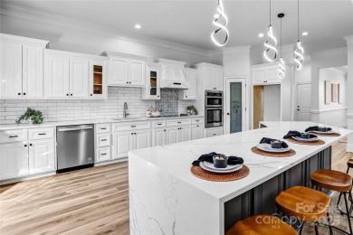 Experience luxury and privacy on over an acre in Mooresville's on Mallard Head Country Club in North Carolina - for sale on GolfHomes.com, golf home, golf lot
