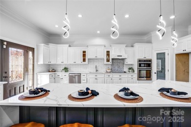 Experience luxury and privacy on over an acre in Mooresville's on Mallard Head Country Club in North Carolina - for sale on GolfHomes.com, golf home, golf lot