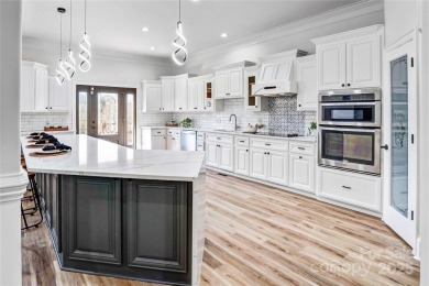 Experience luxury and privacy on over an acre in Mooresville's on Mallard Head Country Club in North Carolina - for sale on GolfHomes.com, golf home, golf lot