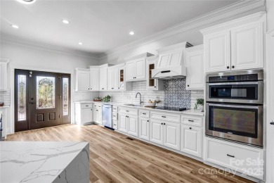 Experience luxury and privacy on over an acre in Mooresville's on Mallard Head Country Club in North Carolina - for sale on GolfHomes.com, golf home, golf lot
